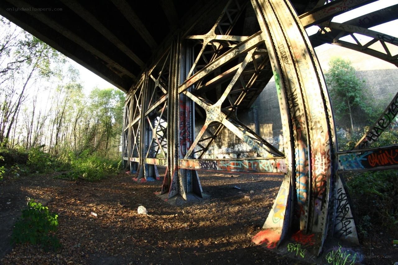 graffiti-covered bridge underpass
