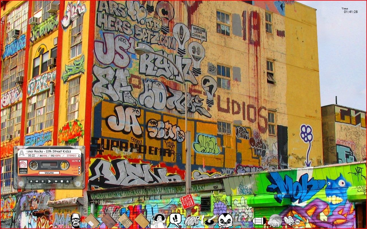 graffiti-covered building with music player
