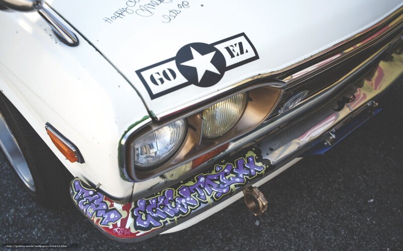 graffiti-covered car front