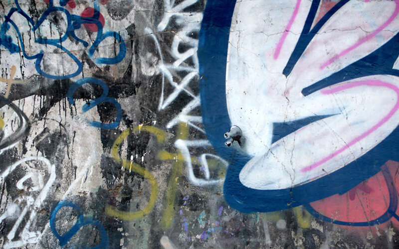 graffiti-covered concrete wall