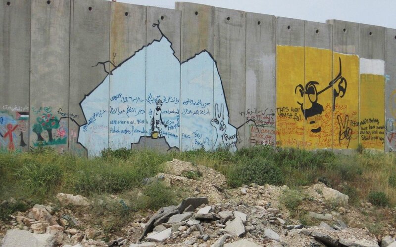 graffiti-covered concrete wall