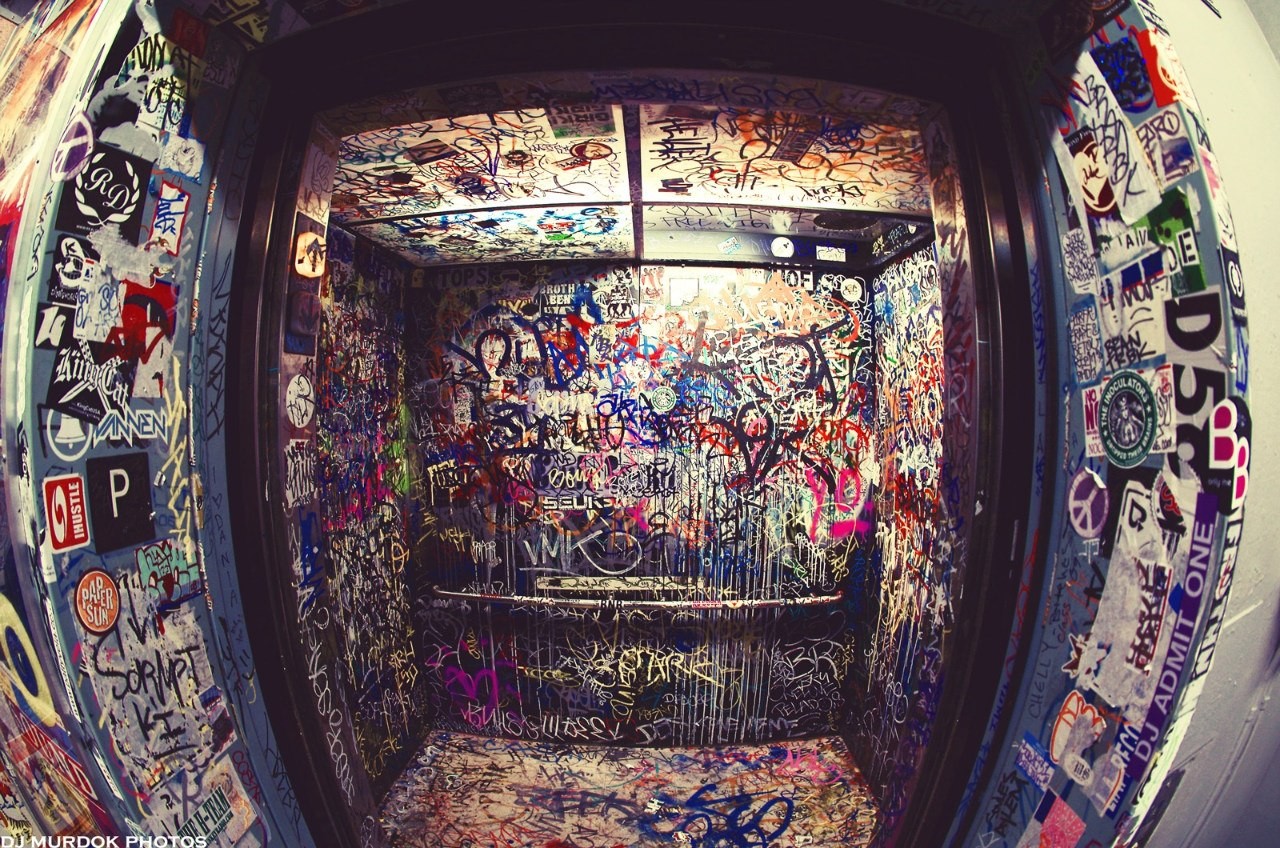 graffiti-covered elevator interior