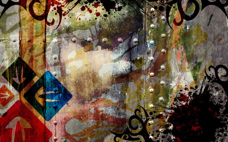 graffiti-covered metal wall