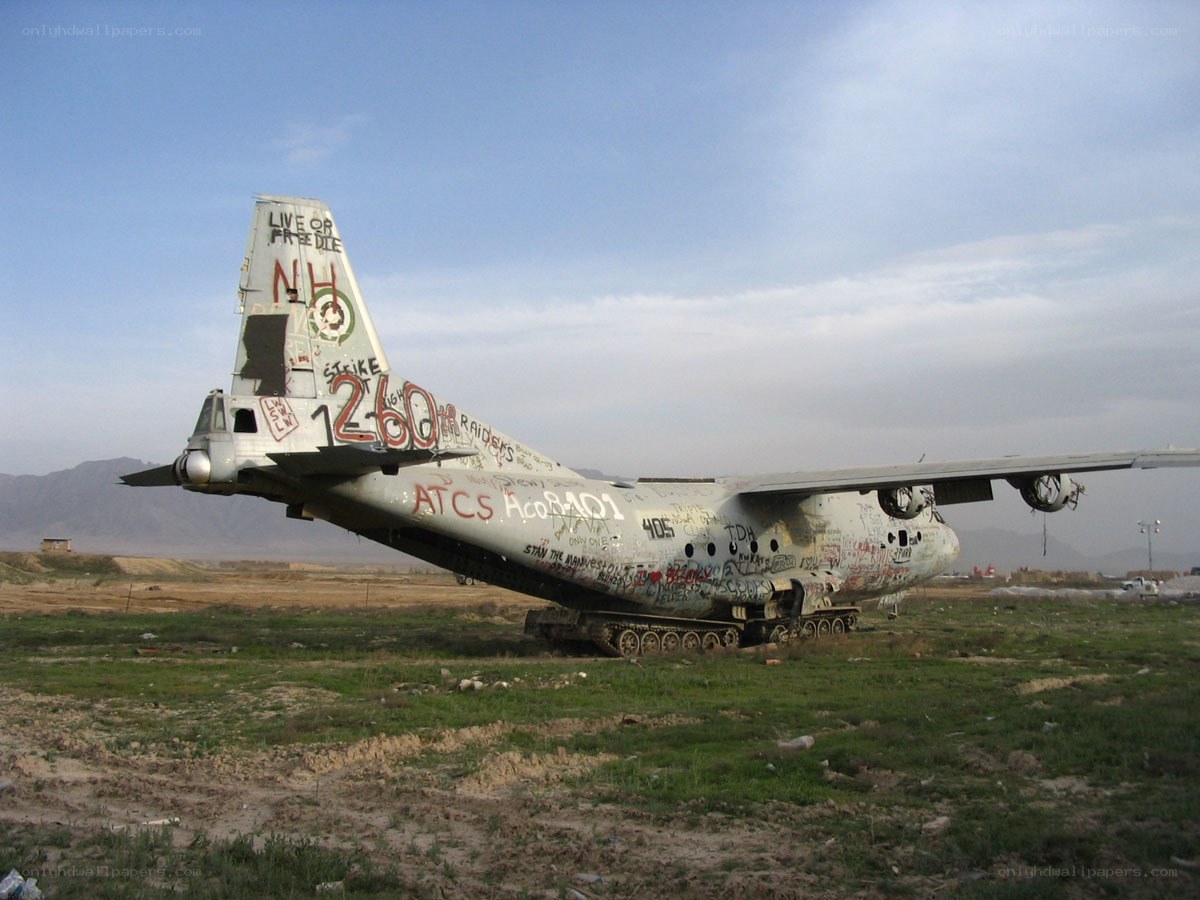 graffiti-covered military plane