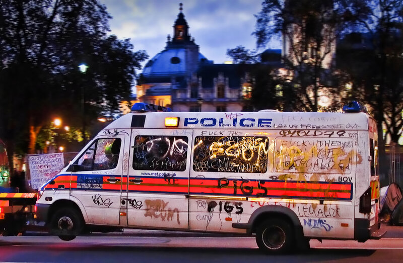 Graffiti-covered police van