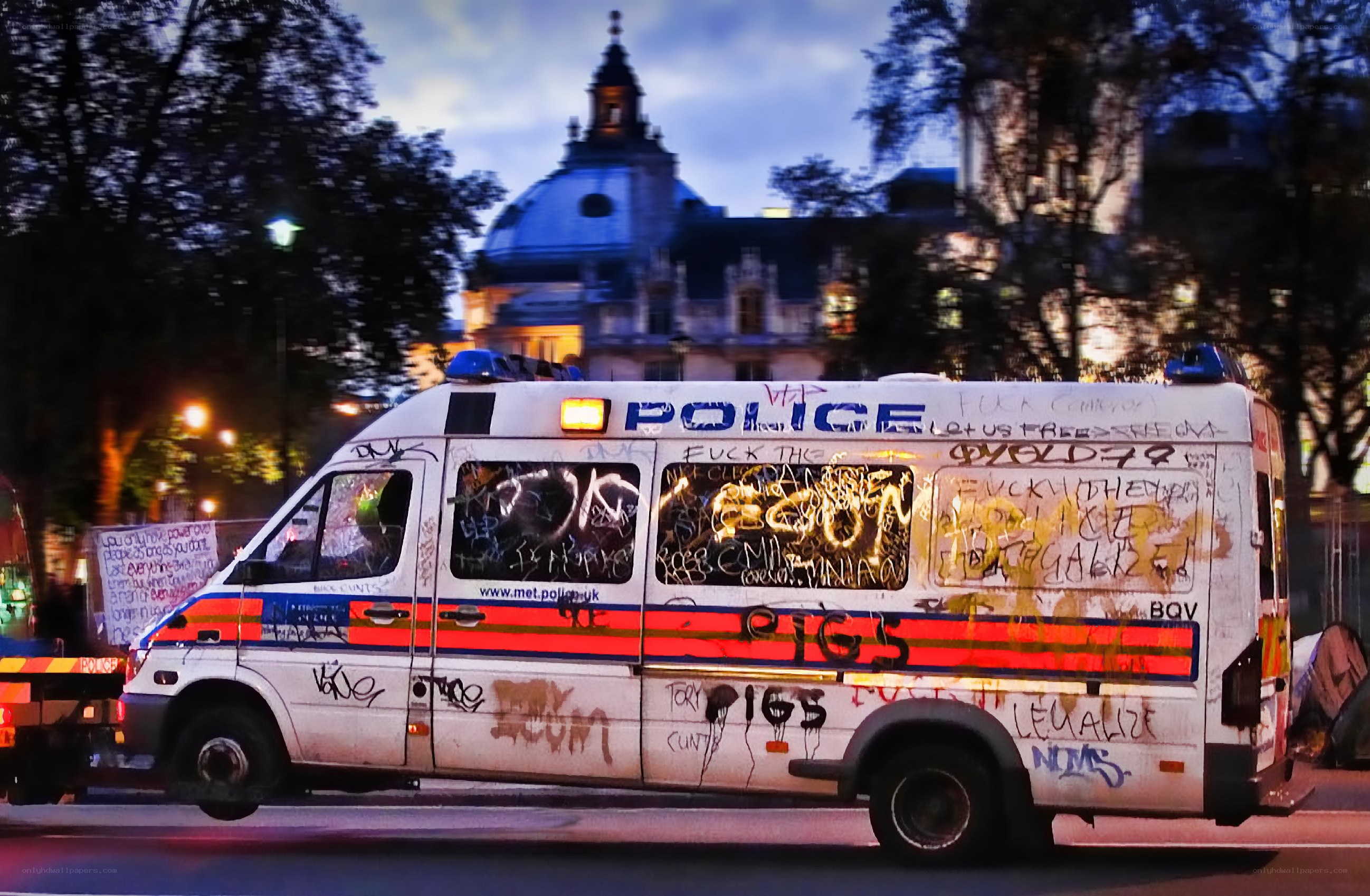 Graffiti-covered police van