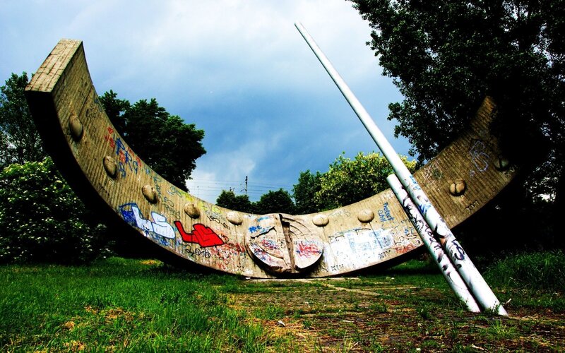 Graffiti-covered sculpture in park