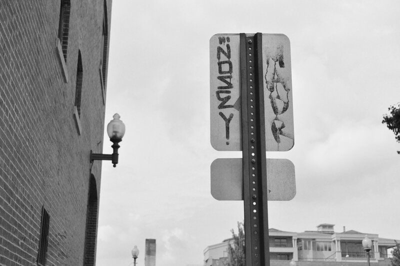 Graffiti-covered Sign