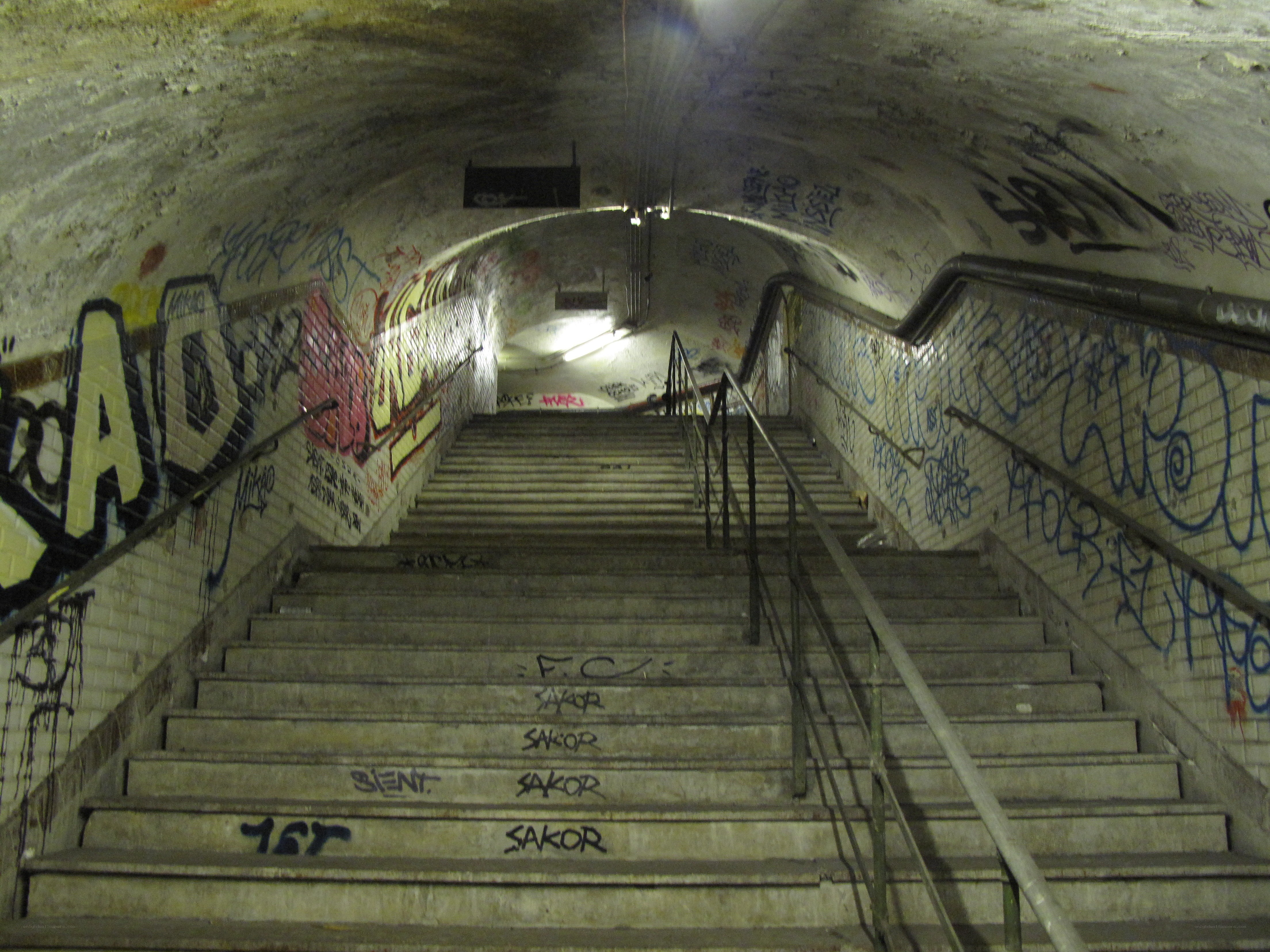 graffiti-covered subway stairs