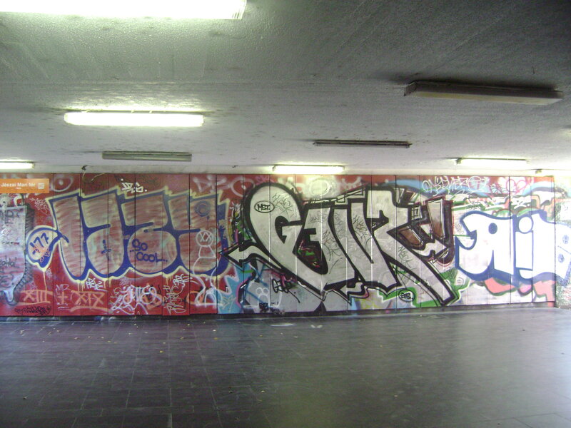 graffiti-covered subway wall
