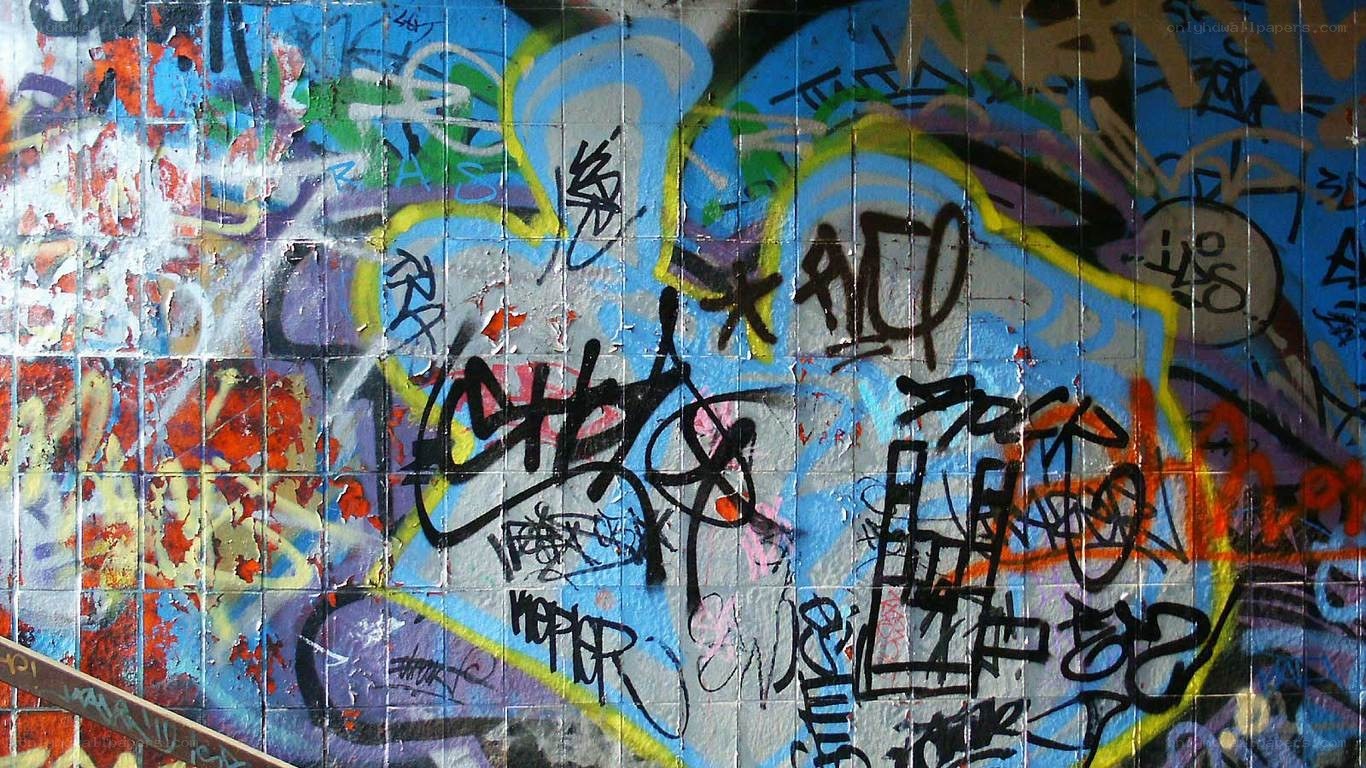 graffiti-covered tiled wall