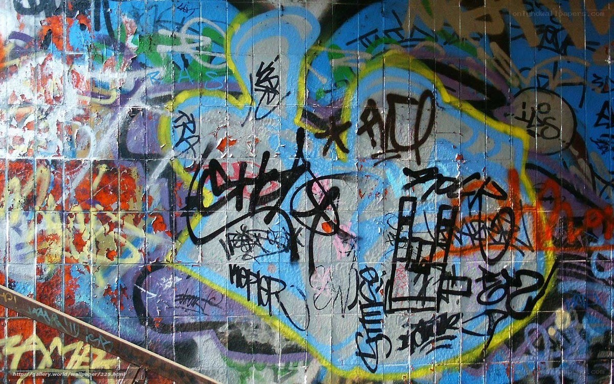 graffiti-covered tiled wall