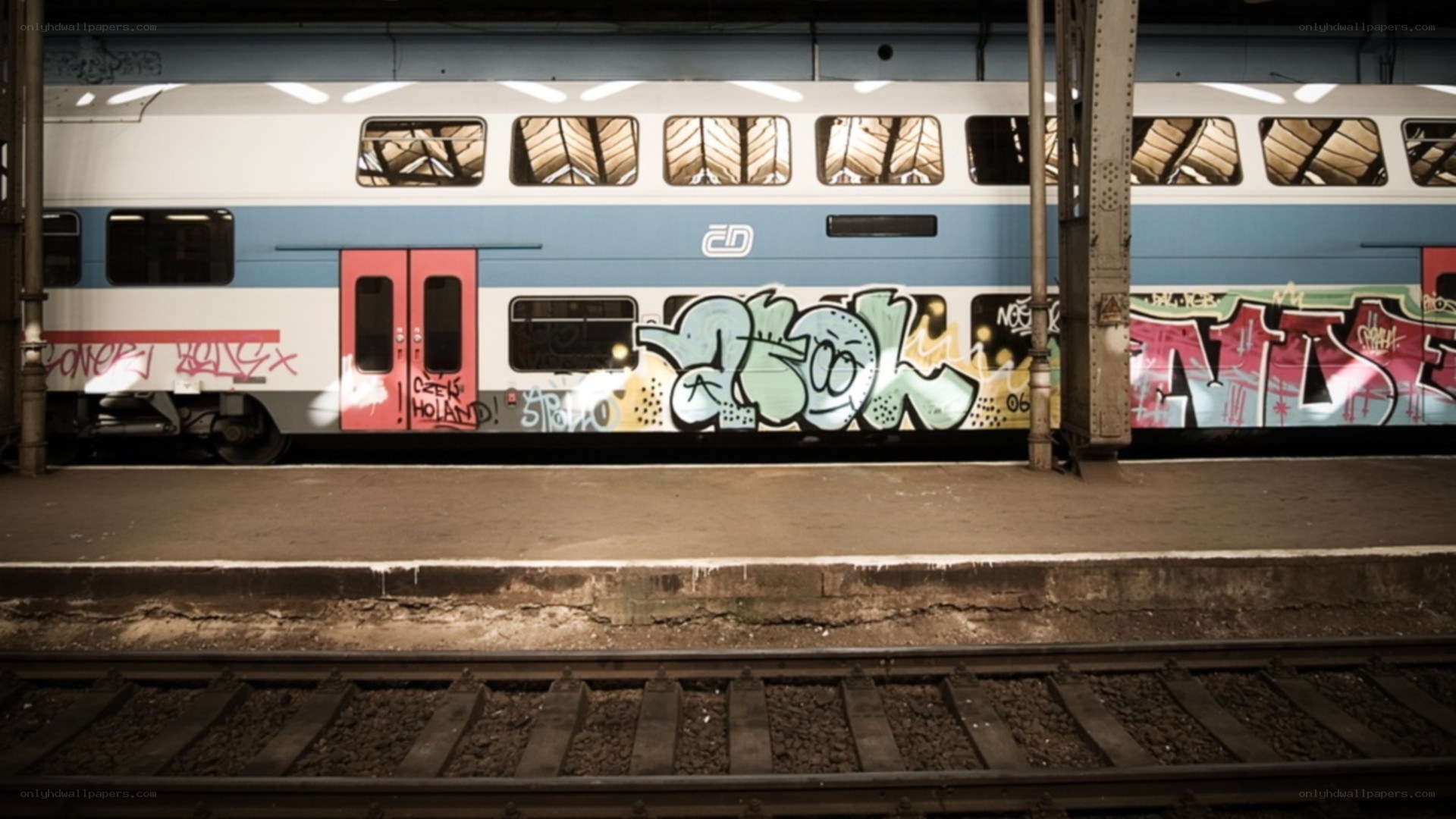 Graffiti-covered train at station