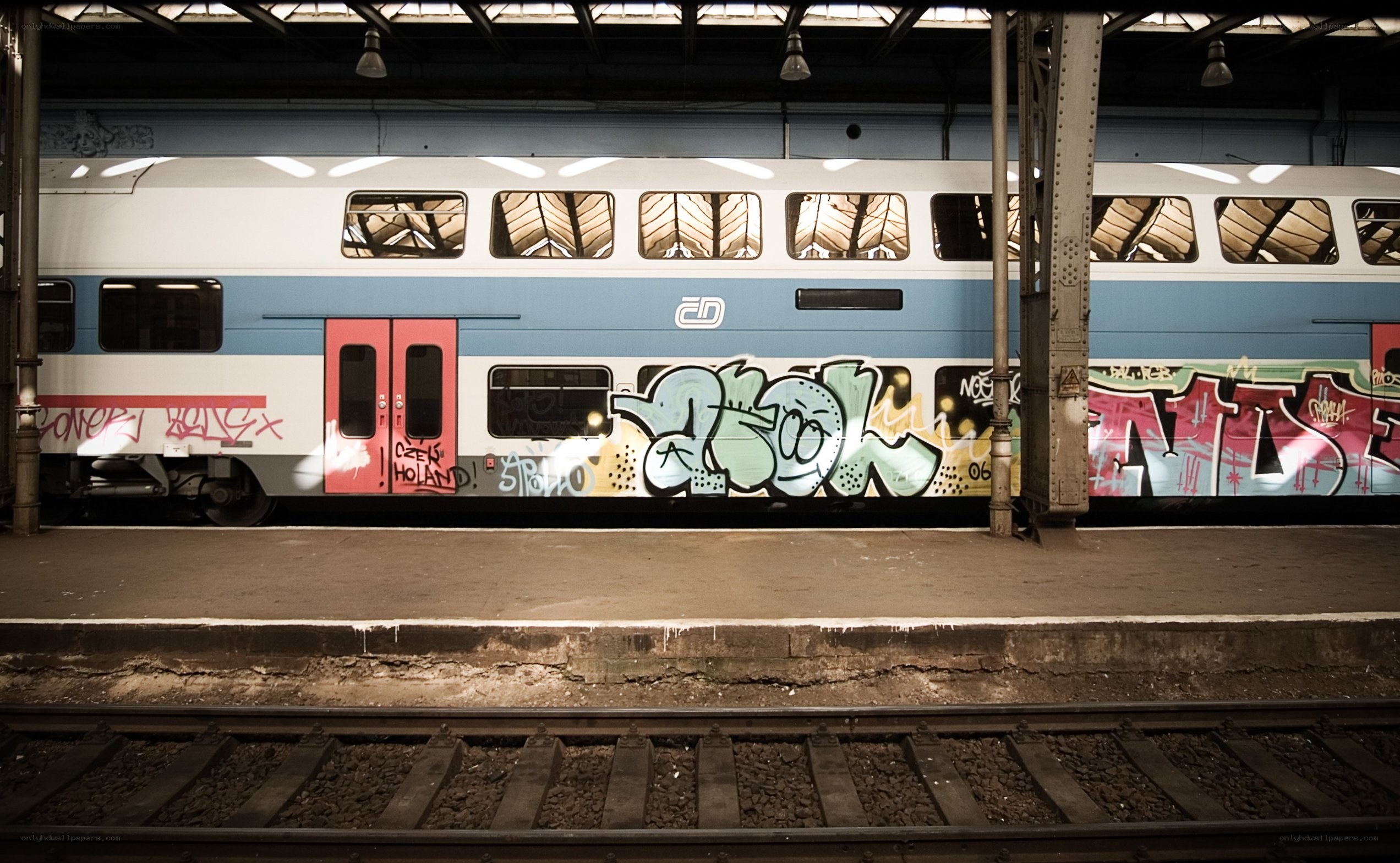 Graffiti-covered train at station