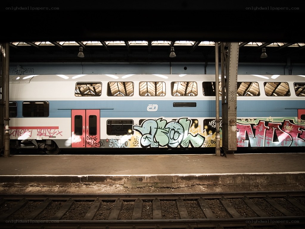 Graffiti-covered train at station