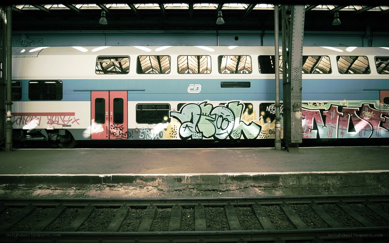 Graffiti-covered train at station