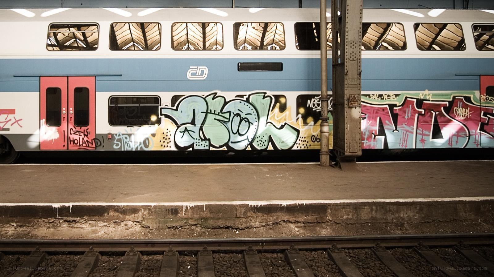 Graffiti-covered train at station
