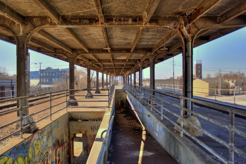 graffiti-covered train bridge