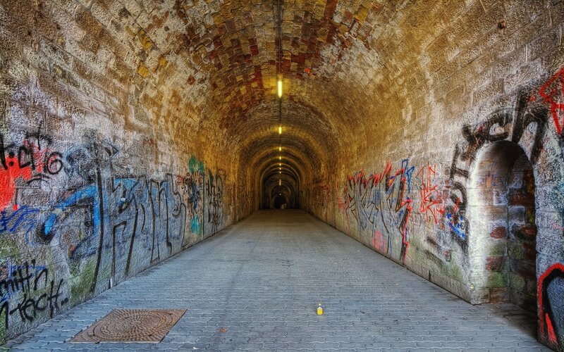 graffiti-covered tunnel