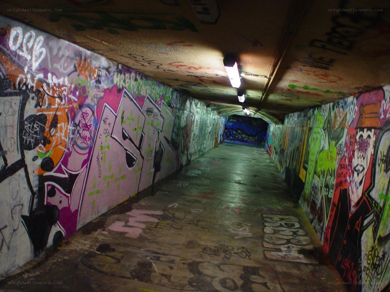 graffiti-covered tunnel