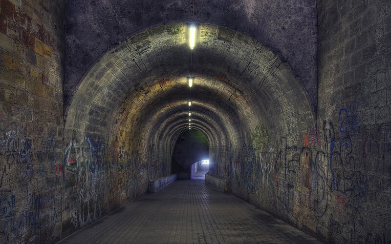 Graffiti-covered Tunnel — Gray, Dramatic