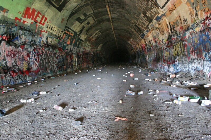 graffiti-covered tunnel interior