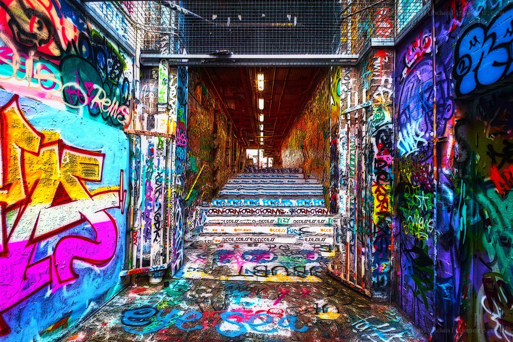graffiti-covered tunnel stairs
