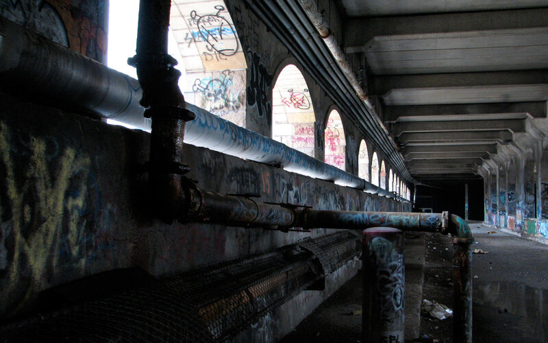 graffiti-covered underpass corridor