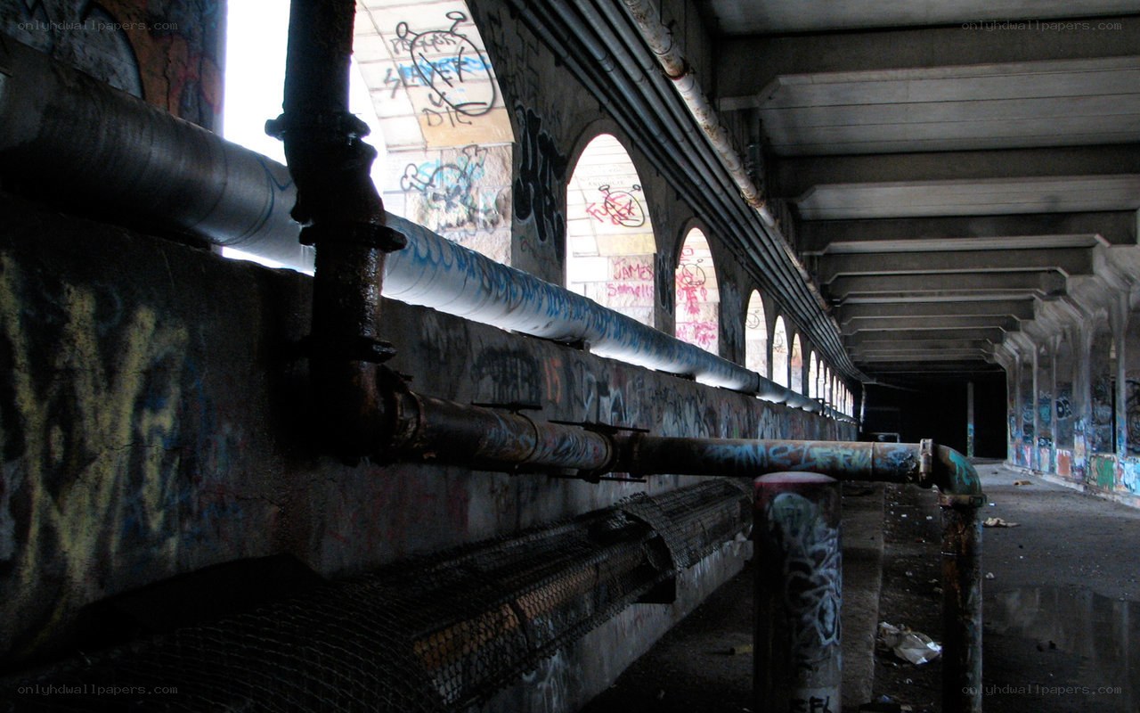 graffiti-covered underpass corridor