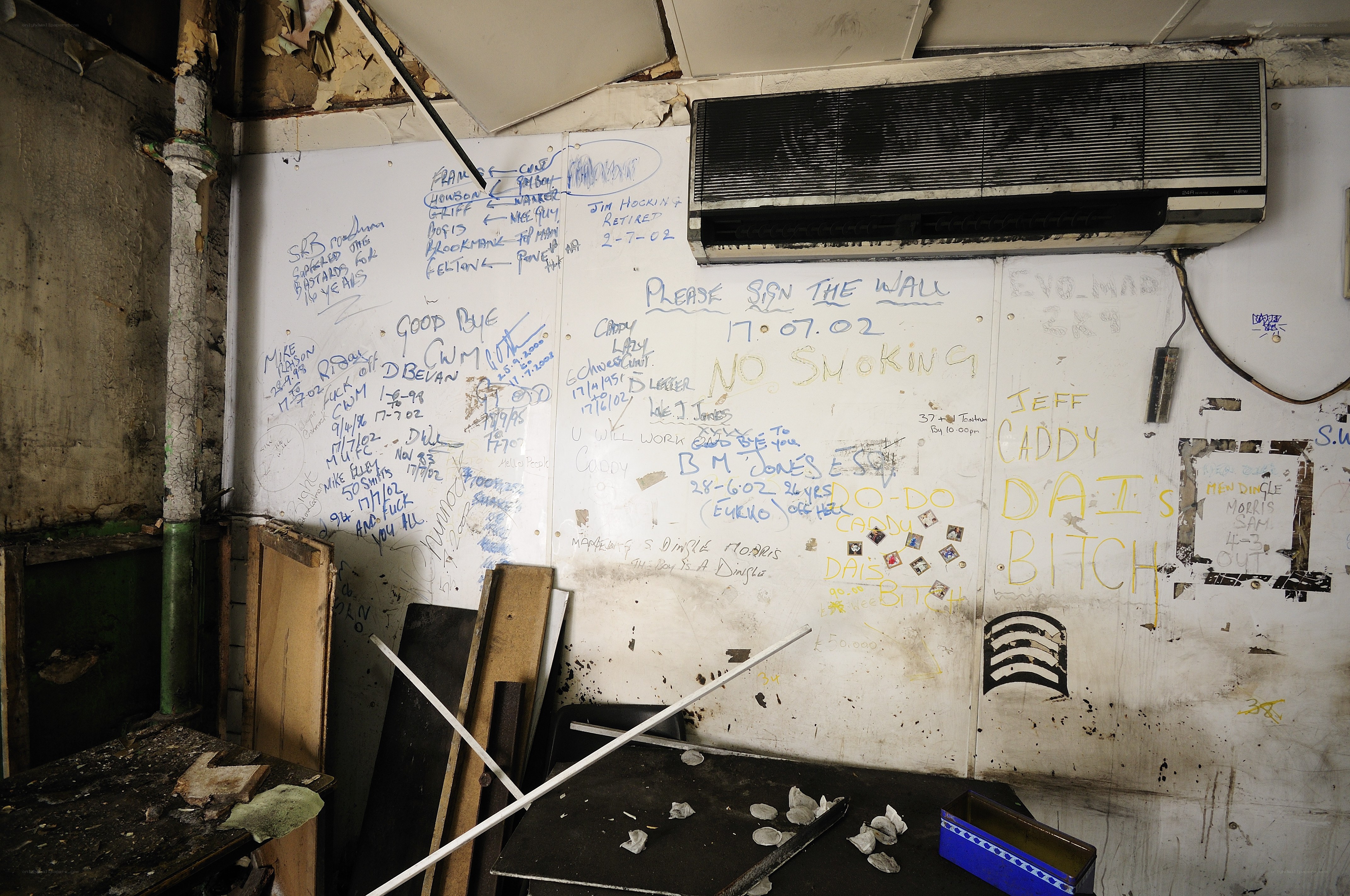 graffiti-covered wall in abandoned room