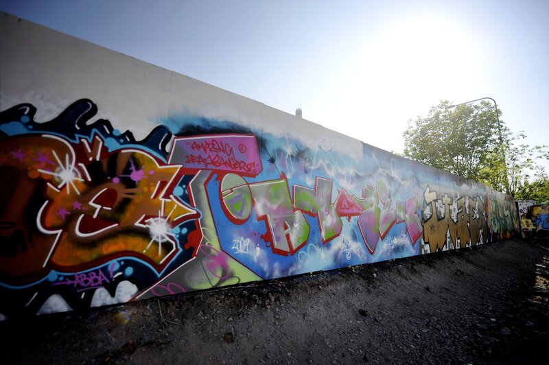 graffiti-covered wall under sun
