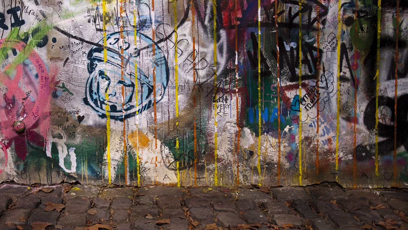 graffiti-covered wall with astronaut