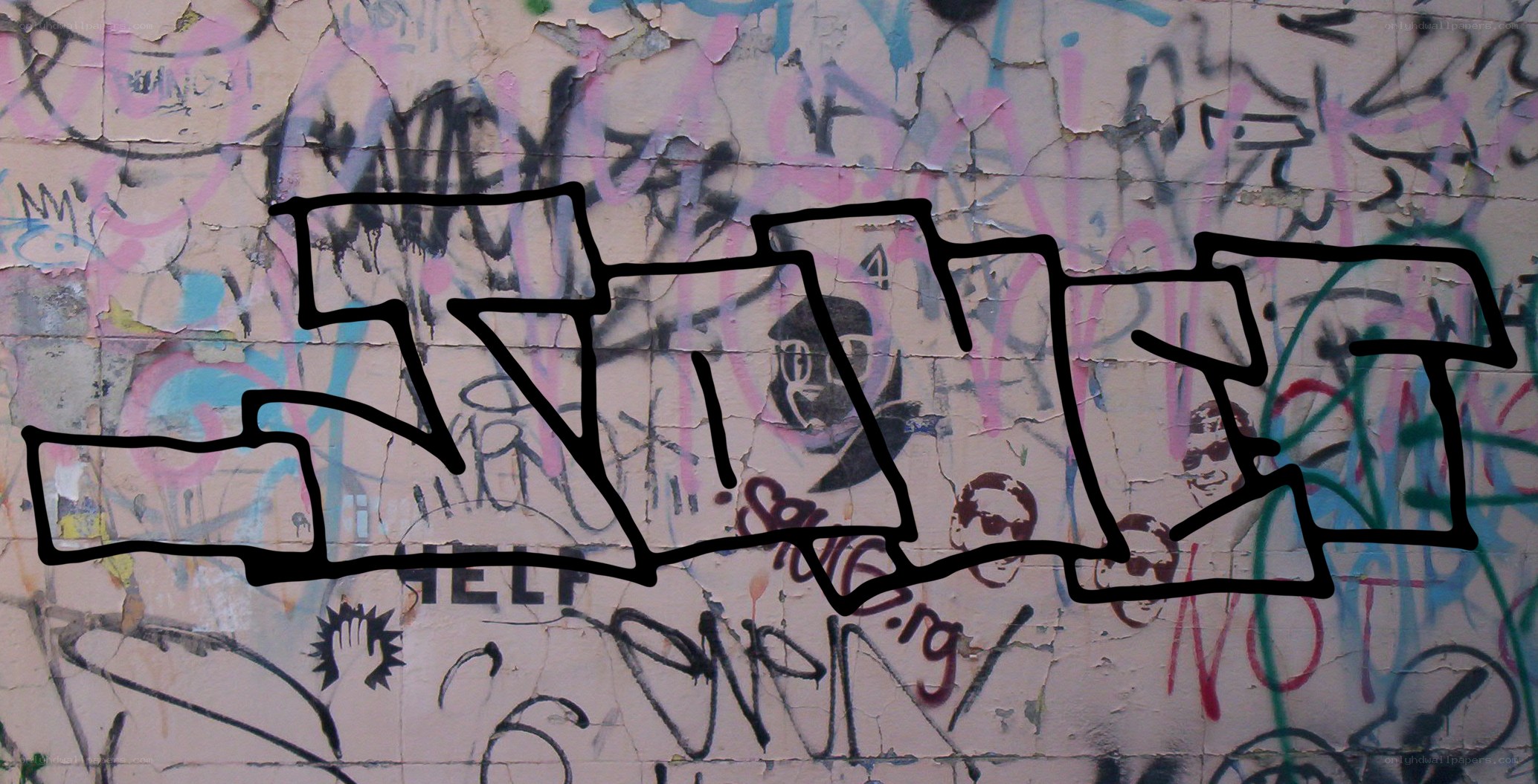 graffiti-covered wall with black outline