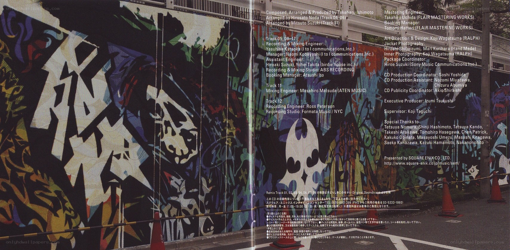 graffiti-covered wall with credits