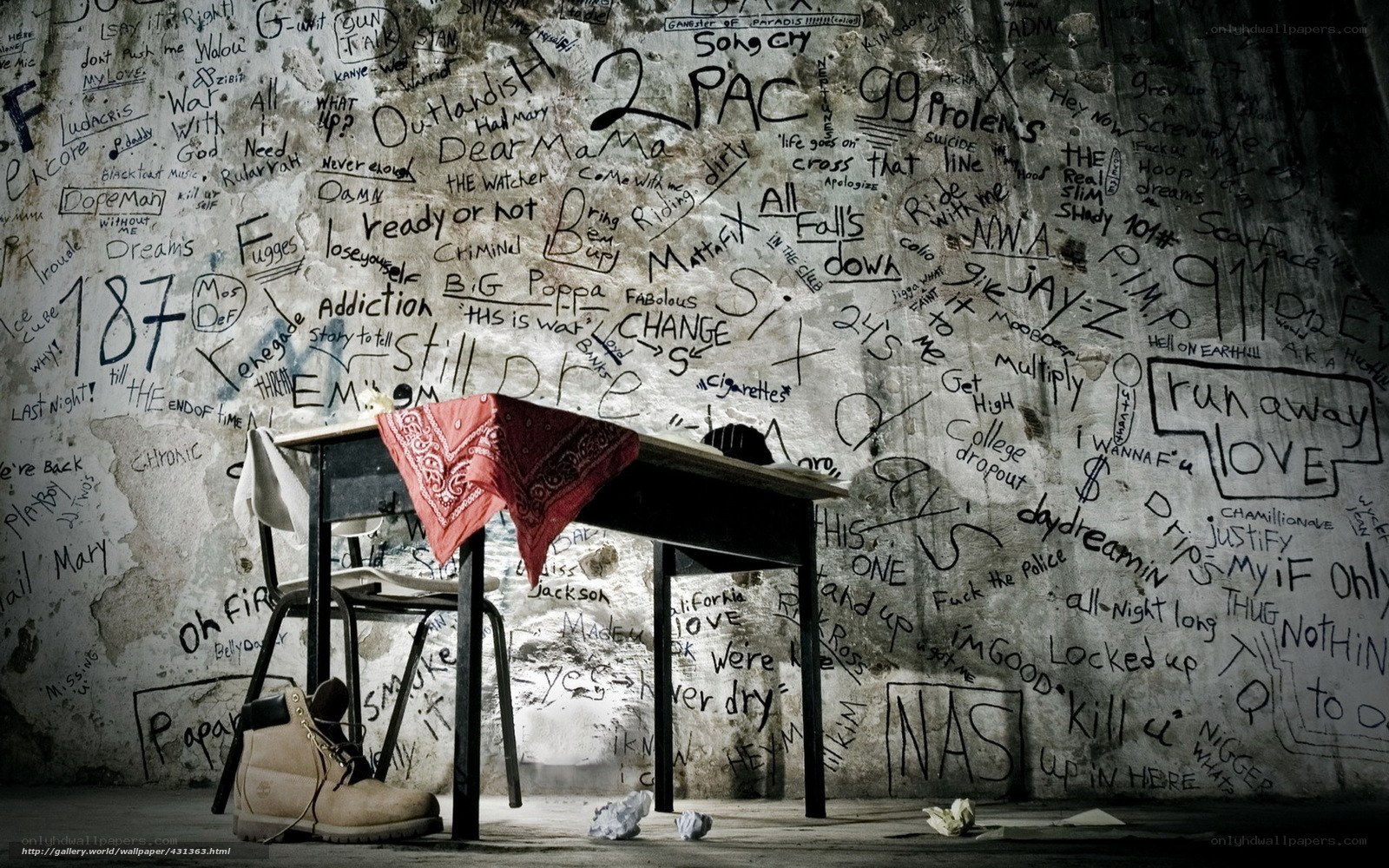 graffiti-covered wall with desk