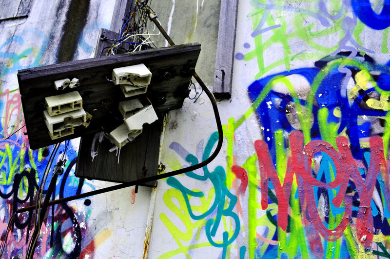 Graffiti-covered wall with electrical box