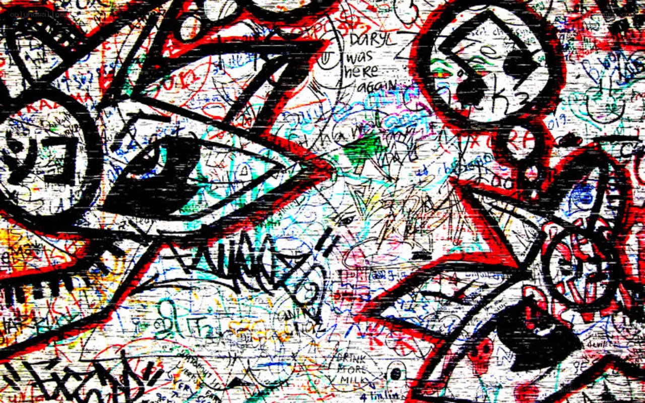graffiti-covered wall with eyes