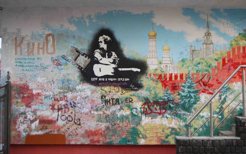 graffiti-covered wall with mural