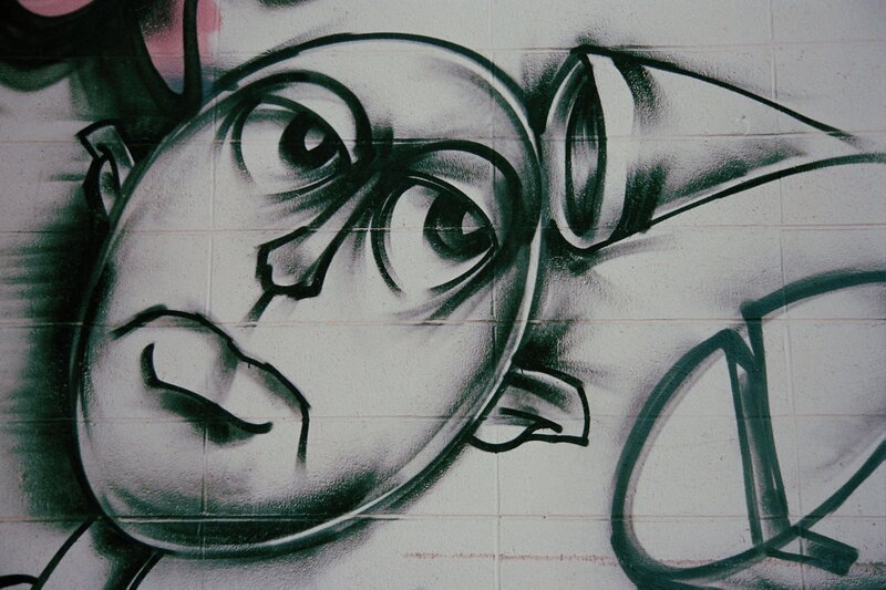graffiti face on wall