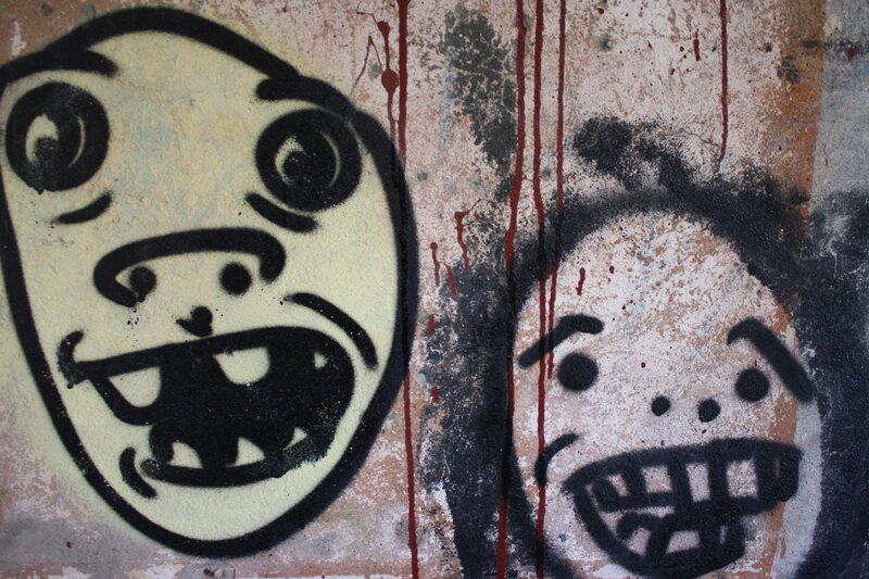 graffiti faces on wall