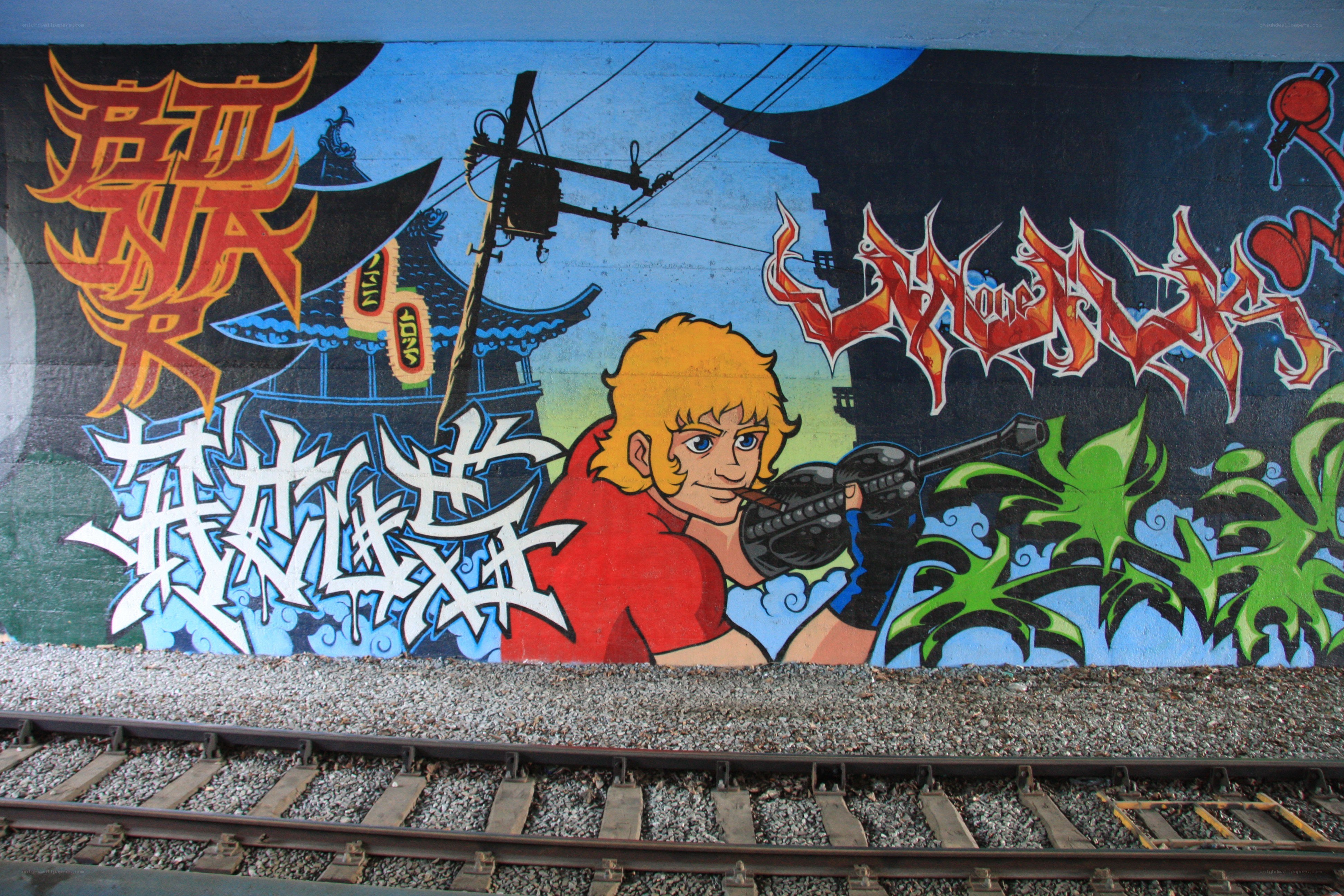 graffiti mural near train tracks