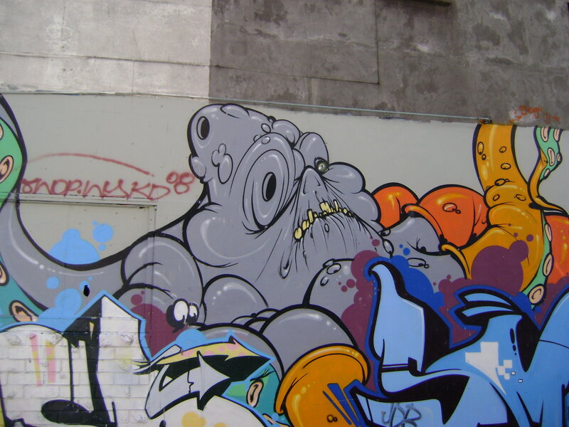 graffiti mural of cartoon monster