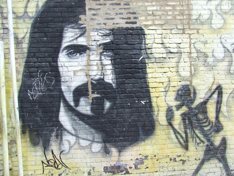 graffiti mural of man and skeleton