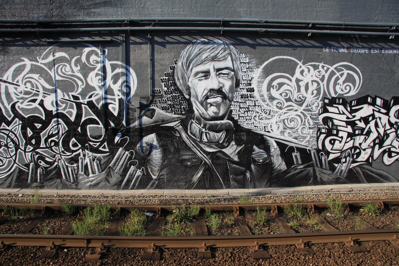 graffiti mural of man on train wall