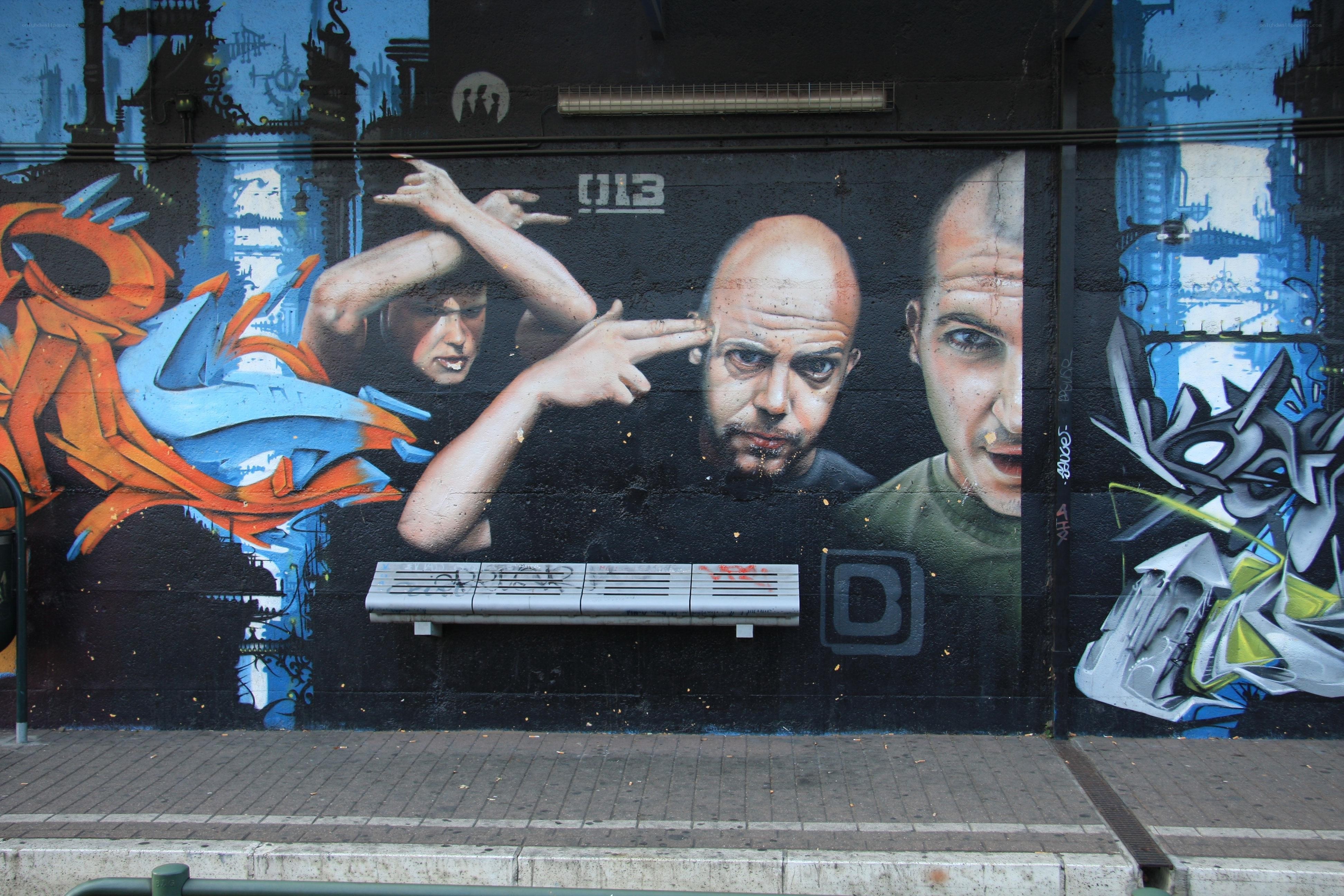 graffiti mural of three men