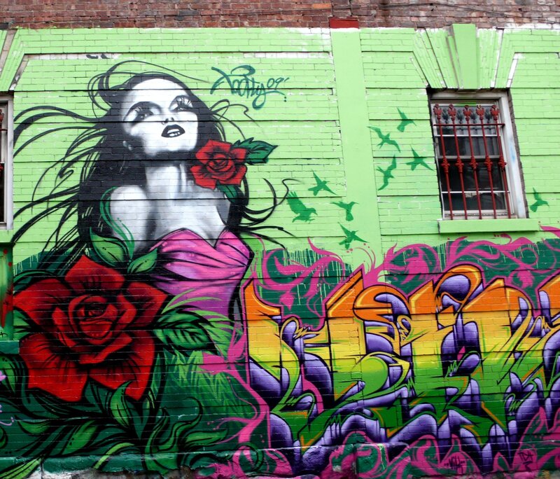 graffiti mural of woman with roses