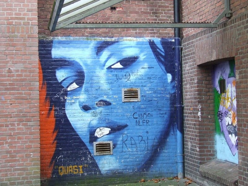 graffiti mural on brick wall