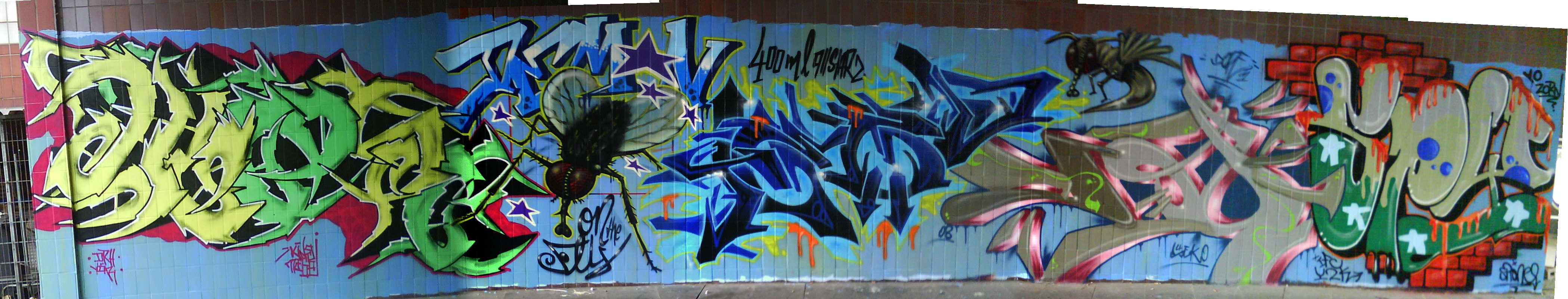graffiti mural on tiled wall