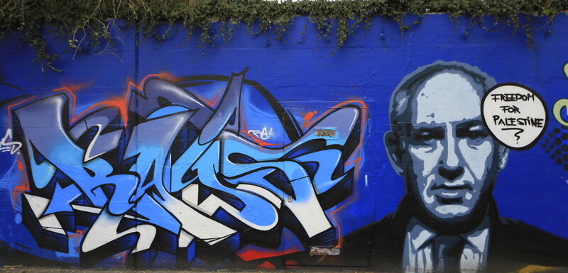 Graffiti Mural on Wall — Blue, Political