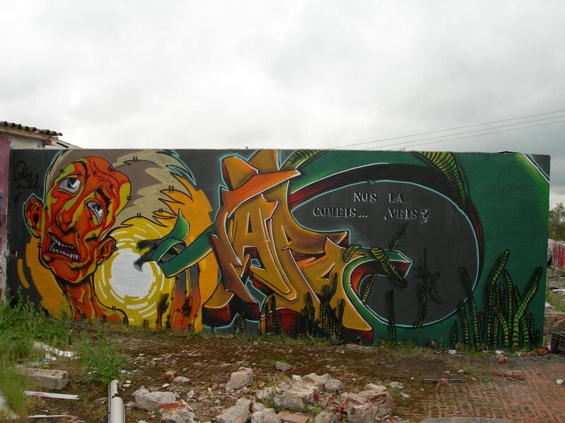 graffiti mural with face and text